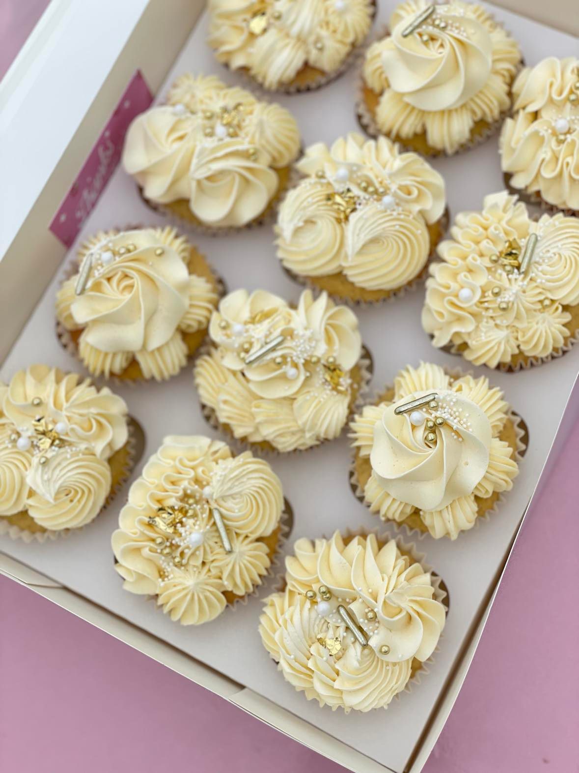 White and gold mixed piping themed cupcakes